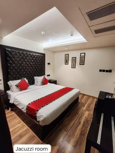 Letto o letti in una camera di Divan Clarks Inn Goa