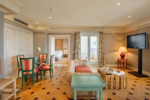 a living room with a couch and a table at Hotel Playa Victoria in Cádiz