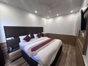 Postel nebo postele na pokoji v ubytování Hotel Obsidian Red