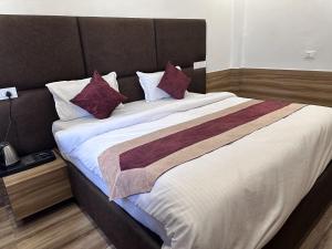 Postel nebo postele na pokoji v ubytování Hotel Obsidian Red