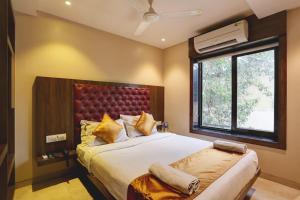 En eller flere senge i et værelse på Hotel Sea Breeze