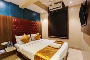 En eller flere senge i et værelse på Hotel Sea Breeze