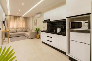 Cuisine ou kitchenette dans l'établissement Appart Hôtel Rambla