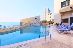 a large swimming pool on top of a building at Ramada Plaza by Wyndham Beirut Raouche in Beirut