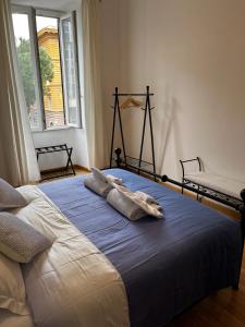 a bed with two pillows on it in a bedroom at Be Your Home - MR House in Rome