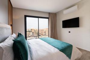 Un ou plusieurs lits dans un hébergement de l'établissement Appart Hôtel Rambla