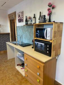 a kitchen with a counter with a microwave on it at Casa rural privada in Orihuela