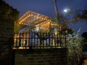 a house with lights on the front of it at Undertree life villa in Hòa Bình