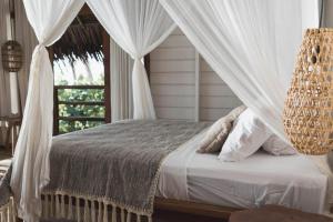 Cama ou camas em um quarto em Kaini Mentawai