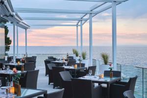 a restaurant with a view of the ocean at Kempinski Hotel Adriatic Istria Croatia in Savudrija