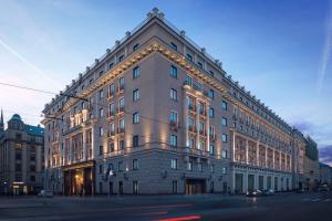 a large building with lights on the side of it at Grand Hotel Kempinski Riga in Riga