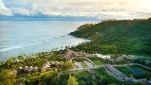 an aerial view of a resort next to the ocean at Kempinski Seychelles Resort in Baie Lazare Mahé