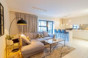 a living room with a couch and a table at GuestReady - City Centre Bliss in Temple Bar in Dublin