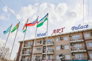 a group of flags in front of a building at Hotel ART PALACE TASHKENT in Chilanzar