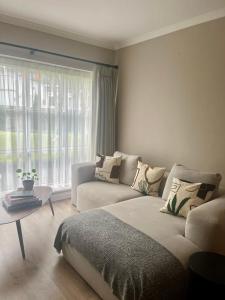 a living room with a bed and a couch at GuestReady - Lovely stay in Dublin in Dublin
