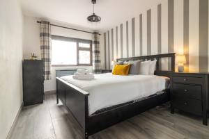 Кровать или кровати в номере GuestReady - Marvellous home in Seabury