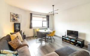 a living room with a couch and a table at GuestReady - Marvellous home in Seabury in Dublin