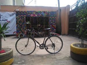 a bike is parked in front of a gate at Unrivaled comfort at Vals Residence with king-sized bed in Lagos