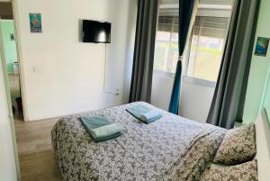 Ένα ή περισσότερα κρεβάτια σε δωμάτιο στο Tiffany Suites Cesano 2