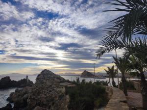 a view of the ocean with a cloudy sky at Casa La Vuelta in Águilas