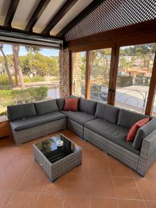 a living room with a couch and a coffee table at Villa Portitxol en Moraira in Moraira