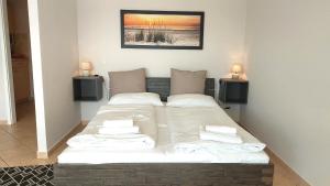 Ein Bett oder Betten in einem Zimmer der Unterkunft Villa Schwan by Rujana