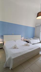 Postel nebo postele na pokoji v ubytování Hotel Canarco