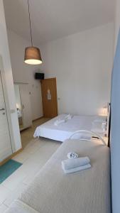 Postel nebo postele na pokoji v ubytování Hotel Canarco