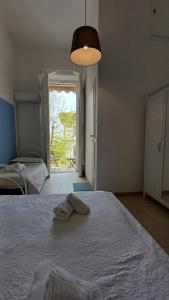 Postel nebo postele na pokoji v ubytování Hotel Canarco
