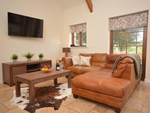 a living room with a couch and a table at 2 Bed in South Molton 62654 in Filleigh