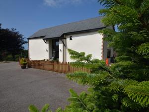 a white building with a black roof at 3 Bed in South Molton 62655 in Filleigh