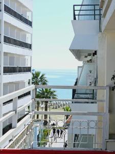 a view of the ocean from the balcony of a building at Stephanie City Apartments in Larnaka