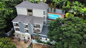 an aerial view of a house with a swimming pool at Greenside Hotel in Arusha