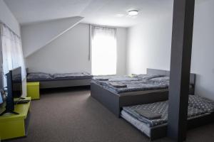 Voodi või voodid majutusasutuse Penzion Fann toas