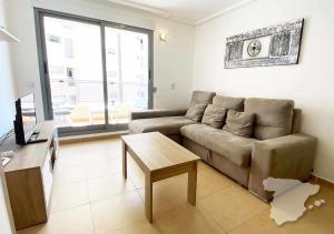 a living room with a couch and a table at CostaBlancaDreams Spanish Dream in Calpe in Calpe