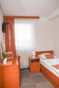 Postel nebo postele na pokoji v ubytování Restavracija in prenočišča ČARDA