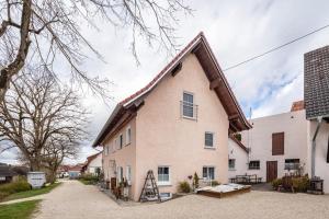 a large white house with a brown roof at Ferienhaus em Biehl in Frankenhofen