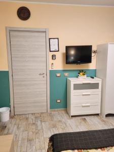 A television and/or entertainment centre at Le terrazze di Alberto
