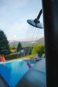 a car with a shower head on the window at Villa Leko Dream House in Cetina