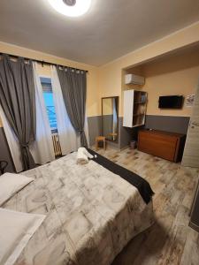 A bed or beds in a room at Le terrazze di Alberto