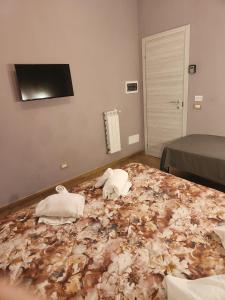 A bed or beds in a room at Le terrazze di Alberto