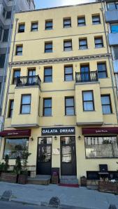 a yellow building with a sign that reads calaja dream at Galata Dream Hotel in Istanbul