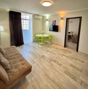 TV a/nebo společenská místnost v ubytování Aparthotel Holiday Lux Batumi