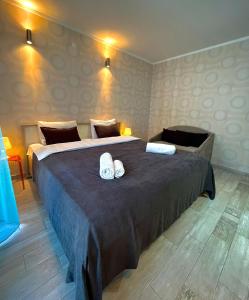 Postel nebo postele na pokoji v ubytování Aparthotel Holiday Lux Batumi