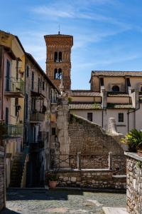 a city with a clock tower in the background at Casa Gioia in Terracina