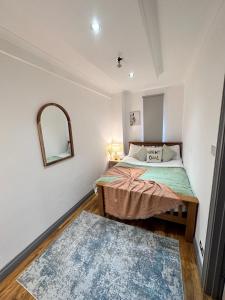 Cama o camas de una habitación en Stylish 2 Bedroom Apartment Central London