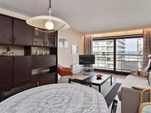 a living room with a couch and a table at Wellington I C5 051 in Wenduine