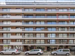 a building with cars parked in front of it at Wellington I C5 051 in Wenduine +3 photos
