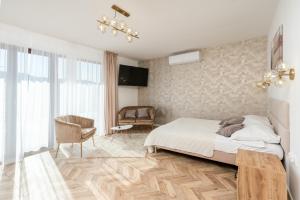 Łóżko lub łóżka w pokoju w obiekcie Hotel Łaziska
