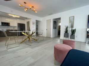 a large living room with a table and chairs at Pinto luxury Village in Hallandale Beach